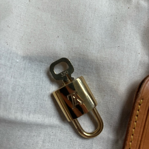 Louis Vuitton lock and key, and tag bundle. - Picture 3 of 4